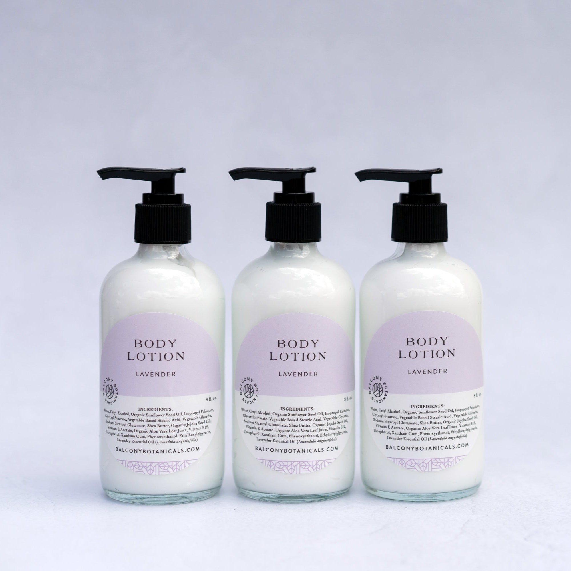 Three glass bottles of Lavender Body Lotion