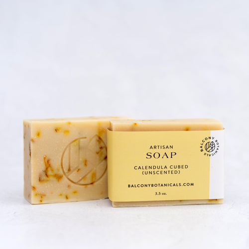 Calendula Cubed Artisan Soap single bar show with flakes of Calendula.