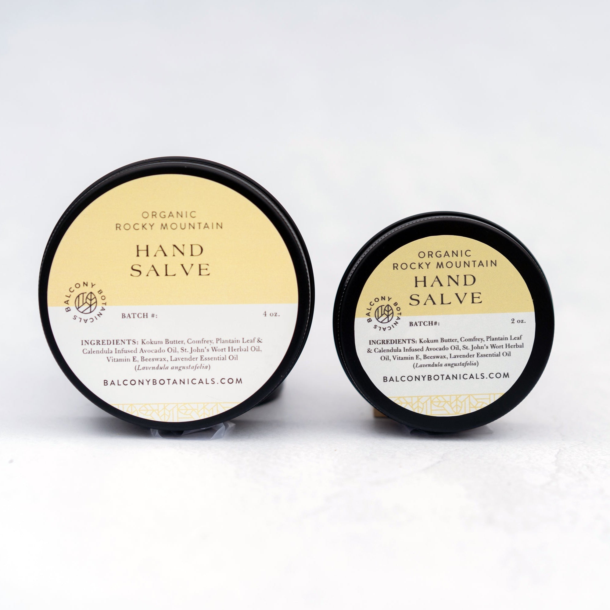 One 4oz and one 2oz black tins of Rocky Mountain Hand salve for cracked, dry skin.