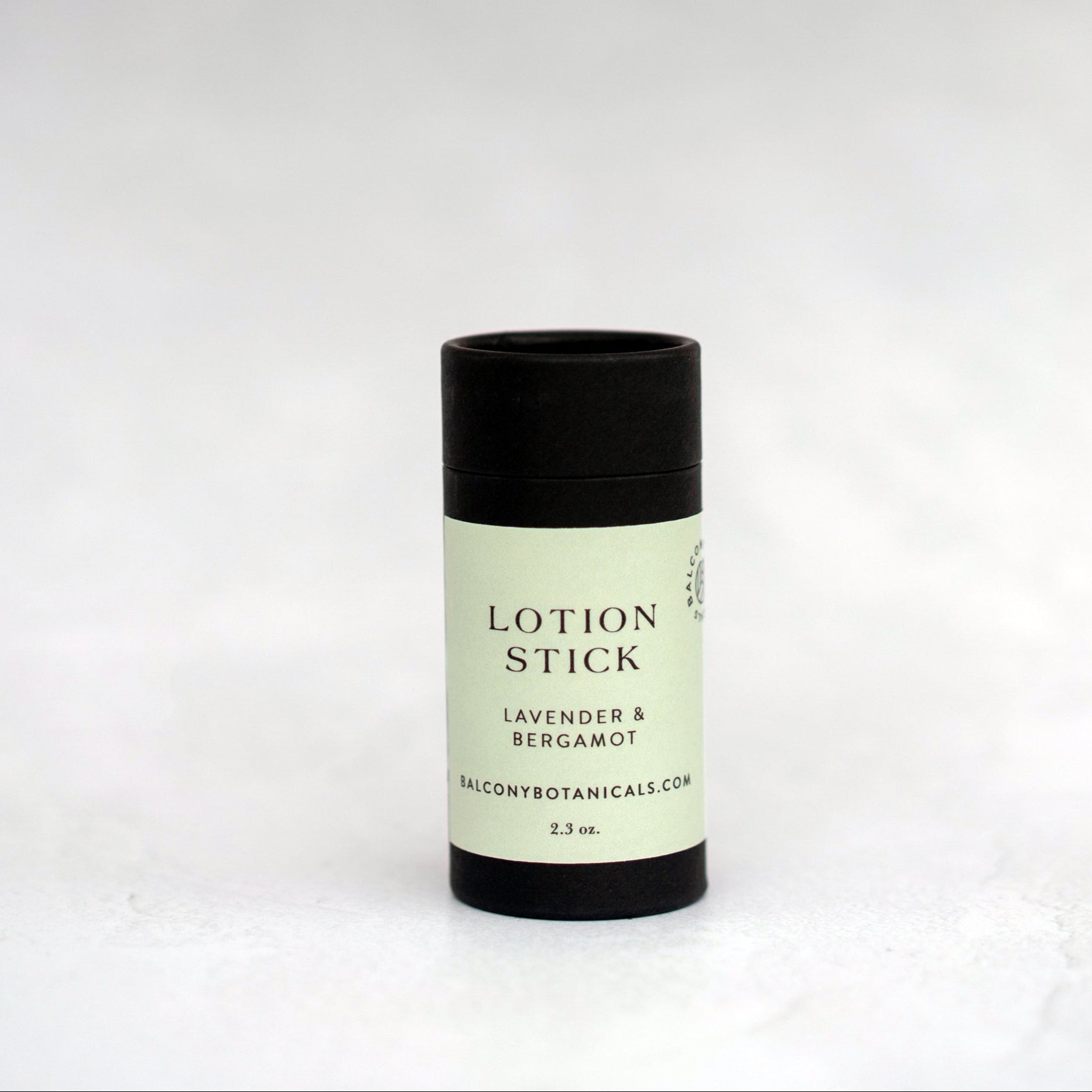 Single Lavender & Bergamot Lotion Stick in a black cardboard push up tube