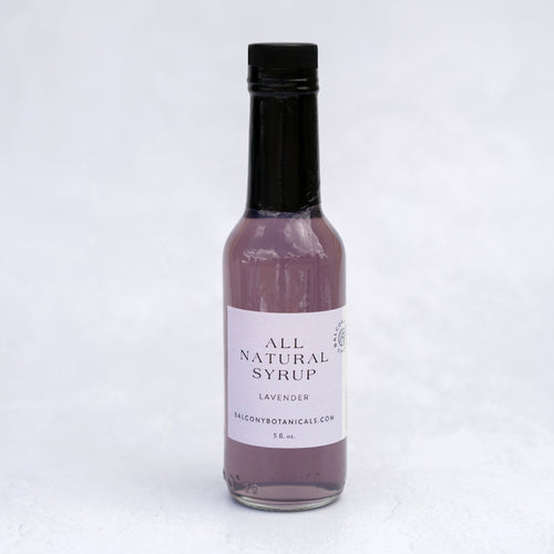 Lavender Simple Syrup in a glass bottle great for flavoring drinks, coffees and teas. 