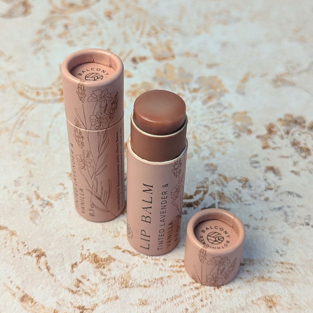 Natural tinted lip balm with lavender and vanilla scent in compostable push-up packaging
