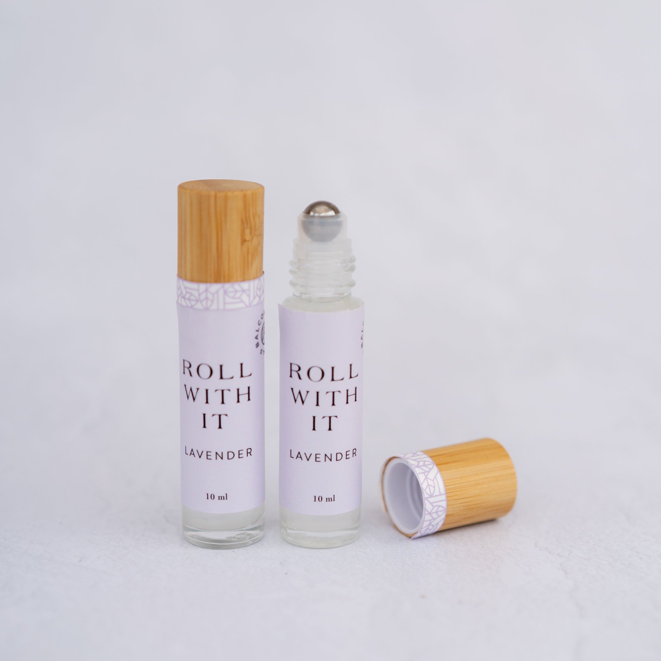 Lavender scented Aromatherapy Roller Ball in glass package with a bamboo top.