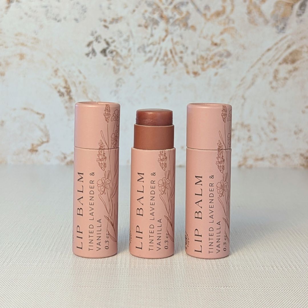 Natural tinted lip balm with lavender and vanilla scent in compostable push-up packaging