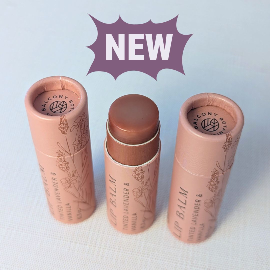 Natural tinted lip balm with lavender and vanilla scent in compostable push-up packaging